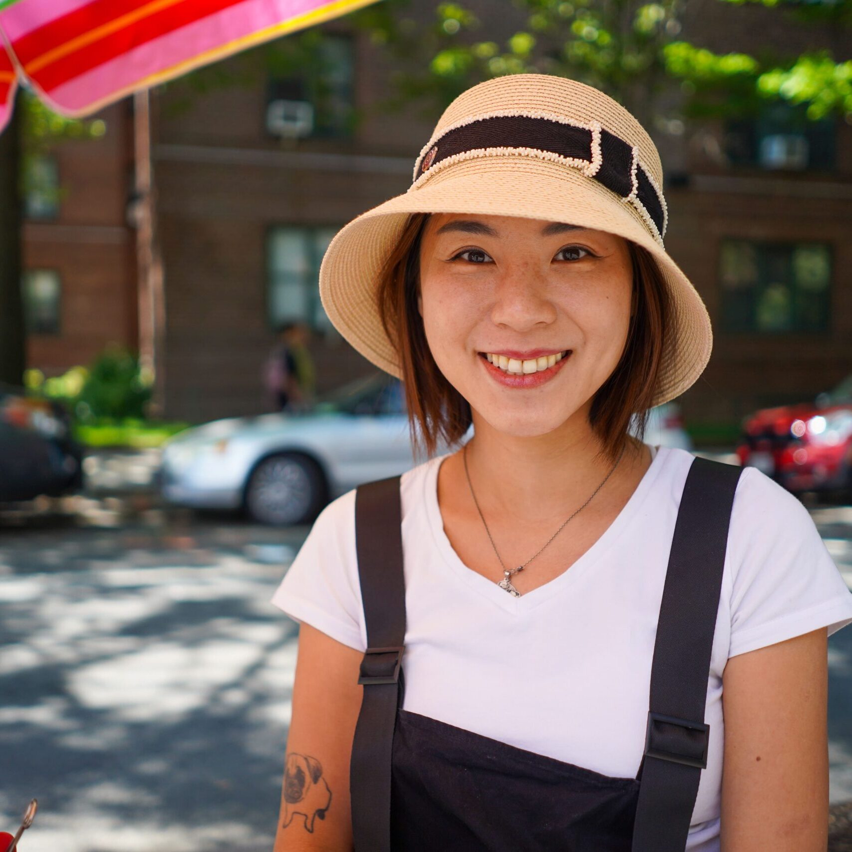 Mickey Lin sits at her station near the Jackson Heights Greenmarket.